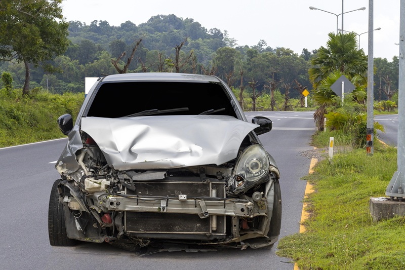 a wrecked car in the road