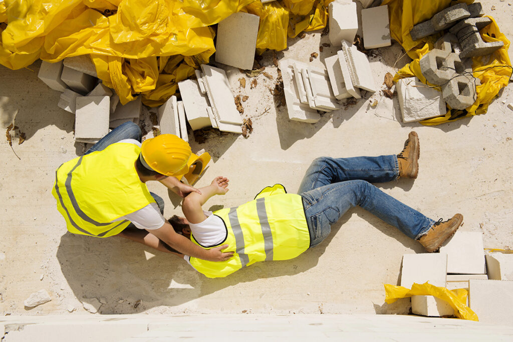 a man assisted another man from accident happened in a construction site