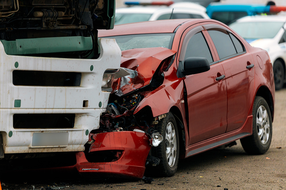 A truck and a car collided on the highway. A serious accident. Road accidents on the road. The car lost control and collided with a truck.